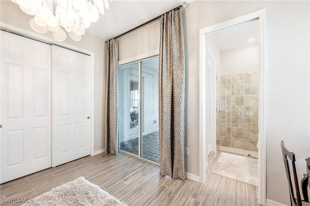 interior space with a closet and a notable chandelier