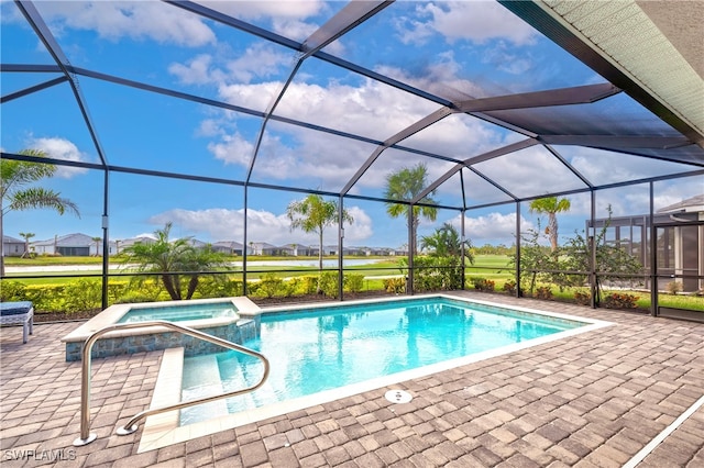 view of swimming pool featuring a lanai, a patio area, and an in ground hot tub