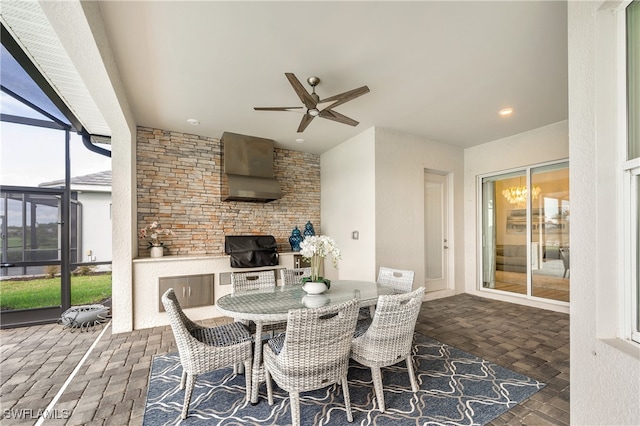 interior space with ceiling fan, a lanai, and a grill