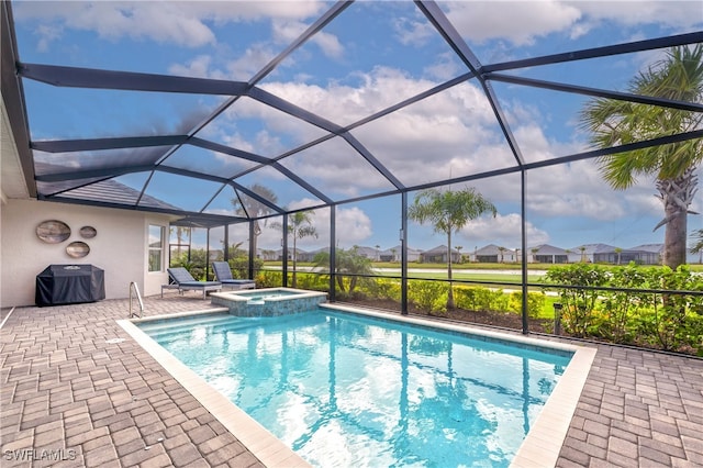 view of swimming pool with area for grilling, a lanai, an in ground hot tub, and a patio