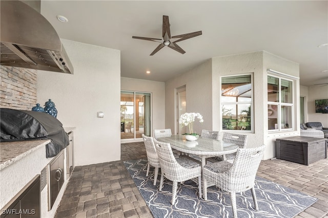 dining space with plenty of natural light and ceiling fan