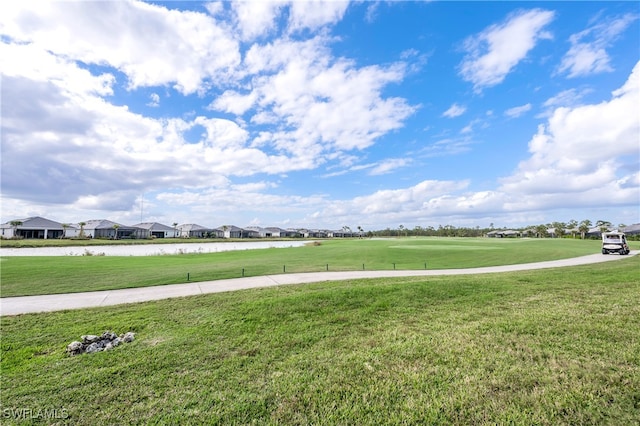 view of property's community featuring a lawn