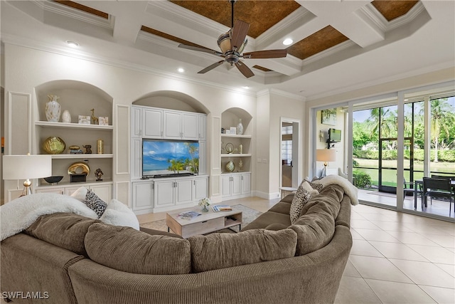 tiled living room with ornamental molding, coffered ceiling, built in shelves, ceiling fan, and beamed ceiling