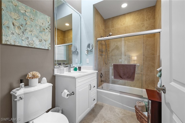 full bathroom with tile patterned flooring, vanity, enclosed tub / shower combo, and toilet