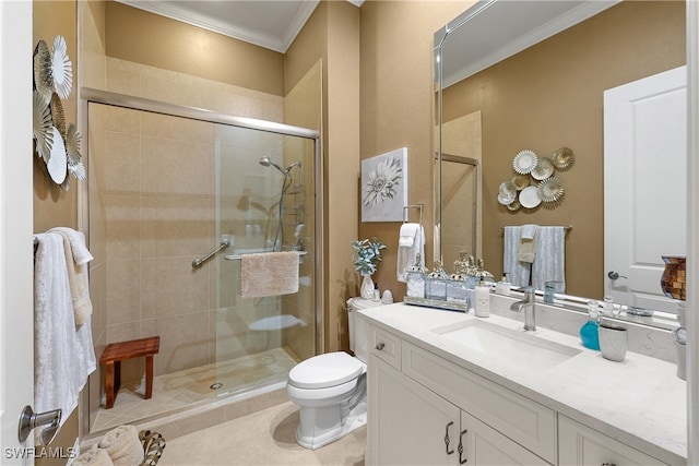 bathroom with vanity, tile patterned flooring, toilet, ornamental molding, and a shower with shower door