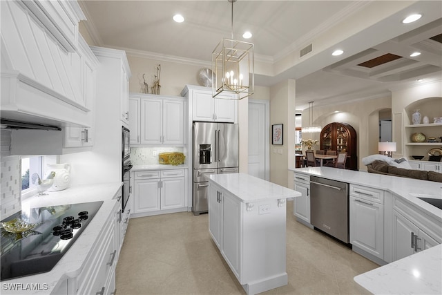 kitchen featuring black appliances, a kitchen island, white cabinets, and crown molding