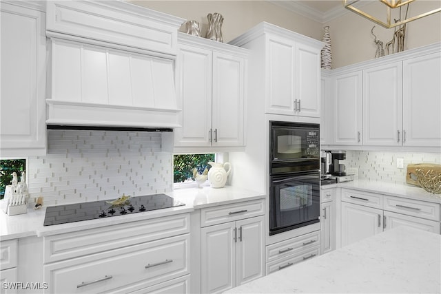 kitchen featuring black appliances, white cabinets, custom range hood, and backsplash