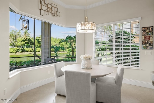 tiled dining room featuring plenty of natural light and crown molding