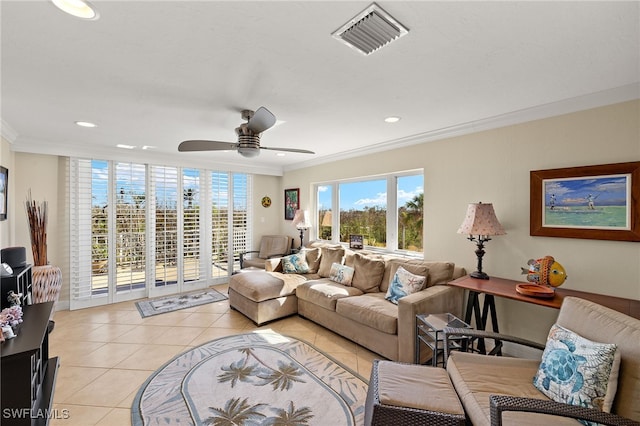 living room featuring ceiling fan, ornamental molding, and light tile patterned flooring