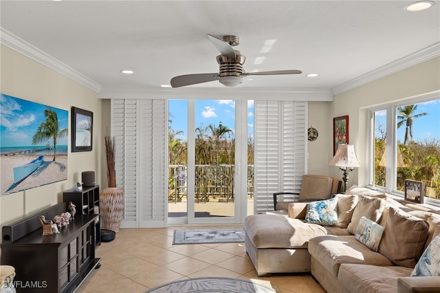 tiled living room with ceiling fan and crown molding