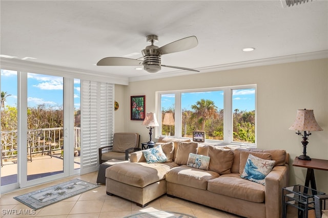 living room with ceiling fan, crown molding, and light tile patterned floors