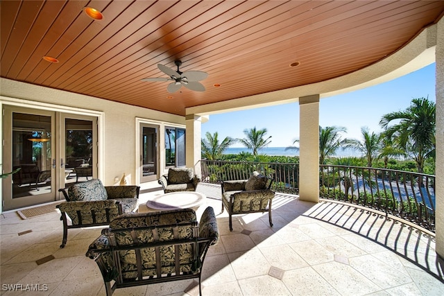 view of patio / terrace with outdoor lounge area, ceiling fan, and french doors