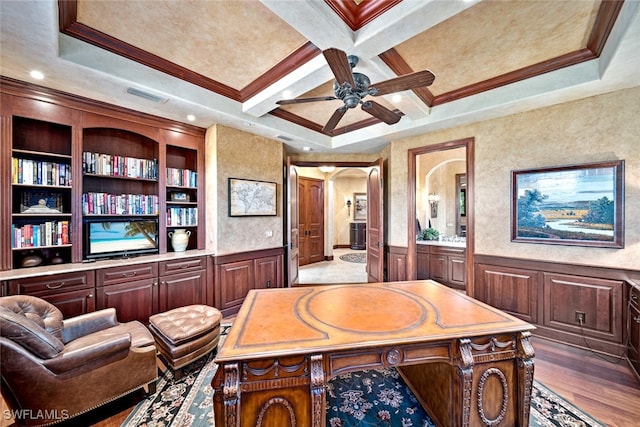 office area with beam ceiling, coffered ceiling, built in features, hardwood / wood-style floors, and ornamental molding