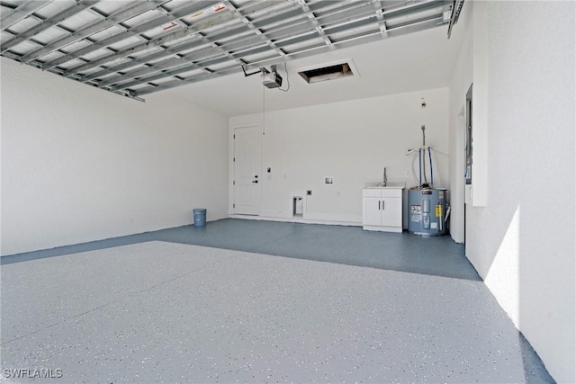 garage with a garage door opener and water heater