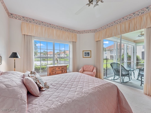 bedroom with carpet flooring, ceiling fan, and access to exterior