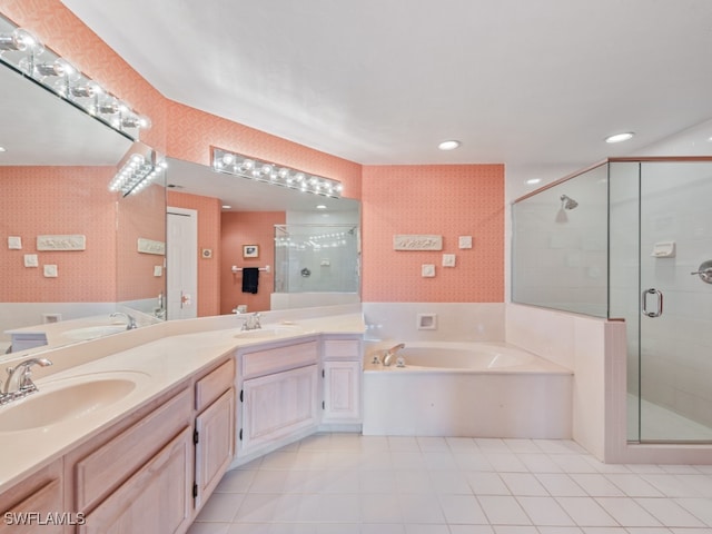 bathroom with tile patterned flooring, vanity, and independent shower and bath