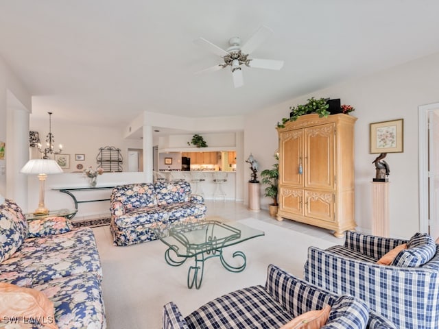 tiled living room featuring ceiling fan with notable chandelier