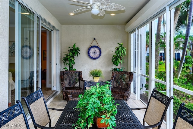 sunroom / solarium with ceiling fan