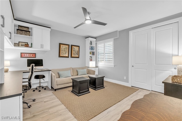 office area with ceiling fan and light hardwood / wood-style flooring