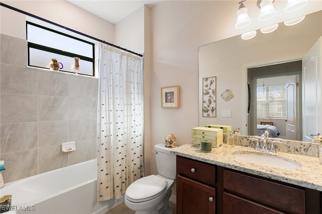 full bathroom with shower / bath combo with shower curtain, vanity, and toilet