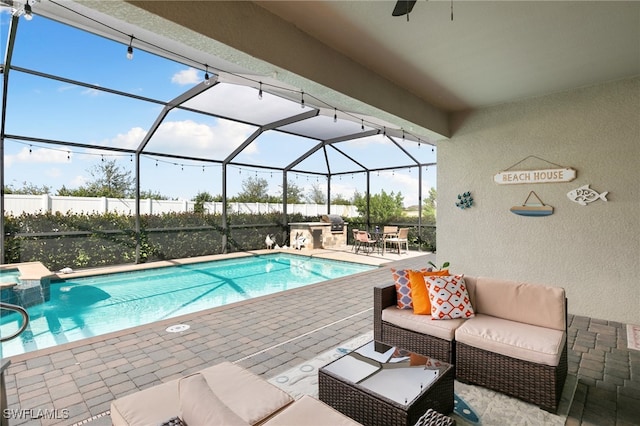 view of swimming pool featuring an outdoor living space, a patio, and glass enclosure