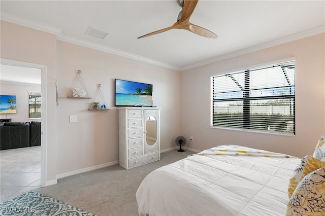 carpeted bedroom with ceiling fan and crown molding