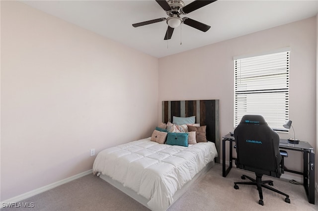 bedroom featuring ceiling fan and light colored carpet