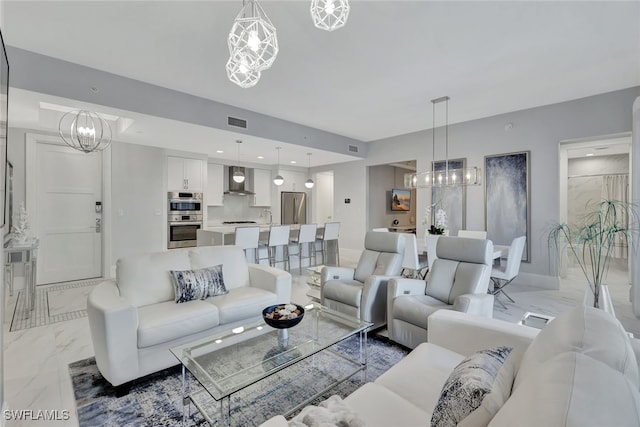 living room featuring a chandelier