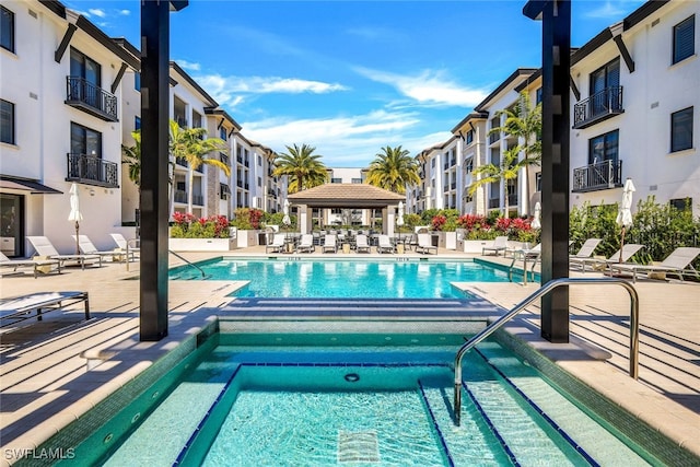 view of swimming pool with a gazebo and a patio