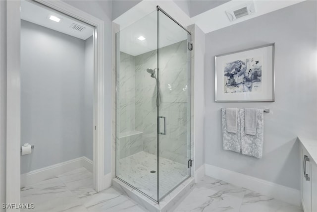 bathroom with a shower with shower door