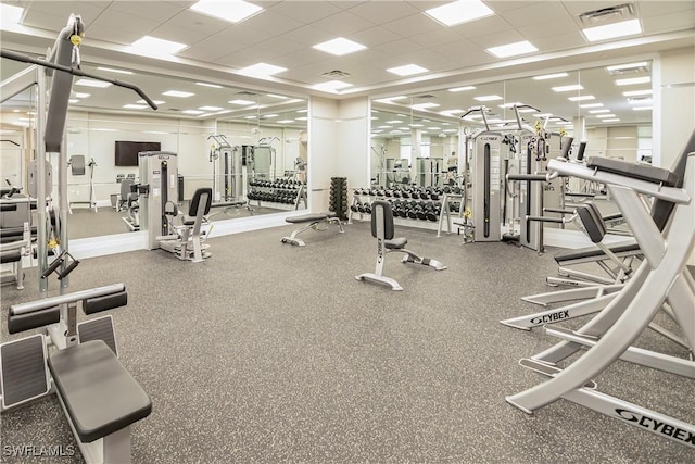 workout area featuring a paneled ceiling