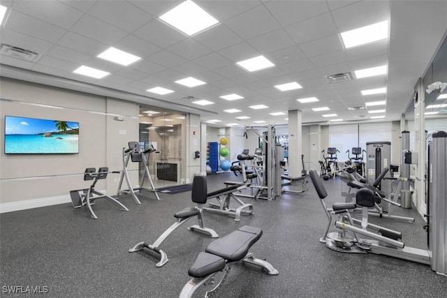 gym featuring a paneled ceiling