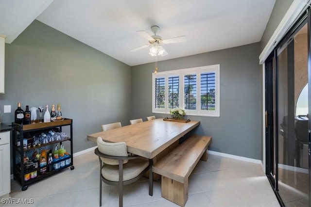 27790 Hacienda E Blvd Unit 206B, Bonita Springs, FL 34135 - dining room featuring ceiling fan, light tile patterned flooring, and baseboards