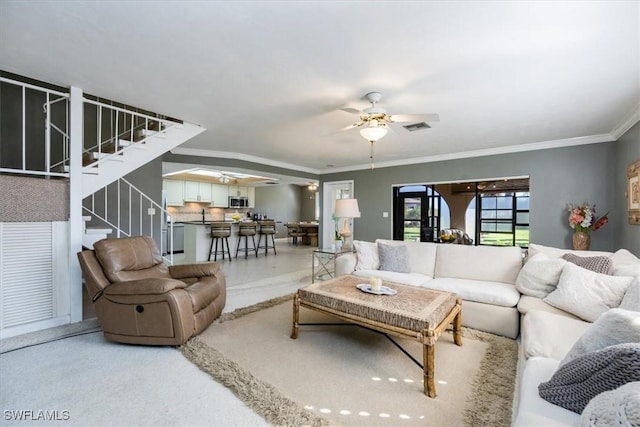 27790 Hacienda E Blvd Unit 206B, Bonita Springs, FL 34135 - living room with ceiling fan, stairway, and ornamental molding