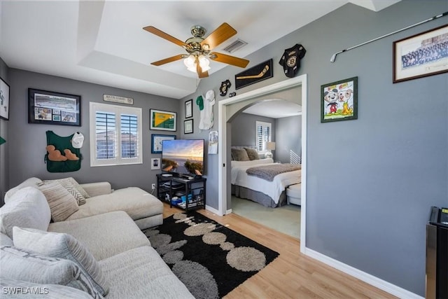 27790 Hacienda E Blvd Unit 206B, Bonita Springs, FL 34135 - living area with plenty of natural light, a ceiling fan, wood finished floors, and arched walkways