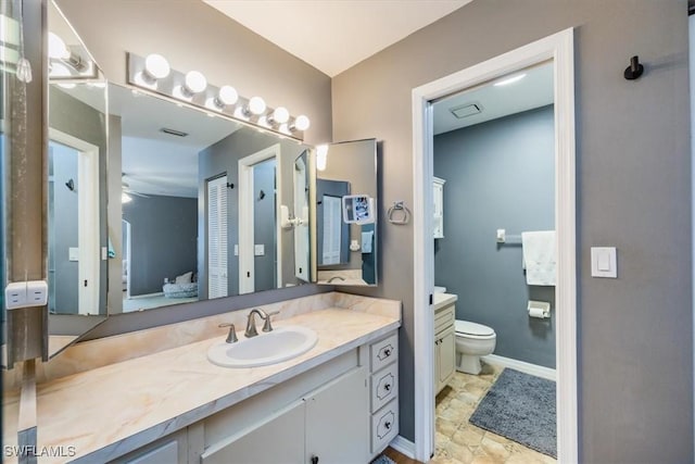 27790 Hacienda E Blvd Unit 206B, Bonita Springs, FL 34135 - bathroom with vanity, toilet, and baseboards