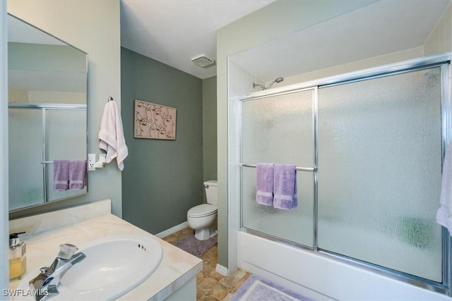 27790 Hacienda E Blvd Unit 206B, Bonita Springs, FL 34135 - full bathroom featuring toilet, vanity, enclosed tub / shower combo, and baseboards