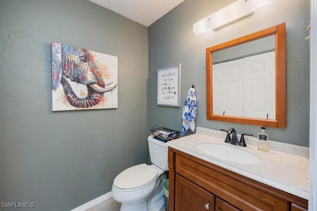 27790 Hacienda E Blvd Unit 206B, Bonita Springs, FL 34135 - half bathroom with vanity, toilet, and baseboards