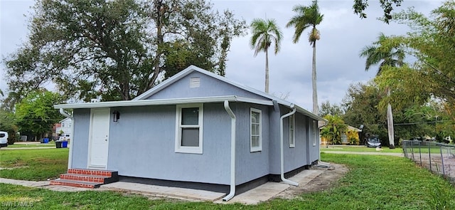 view of home's exterior featuring a yard