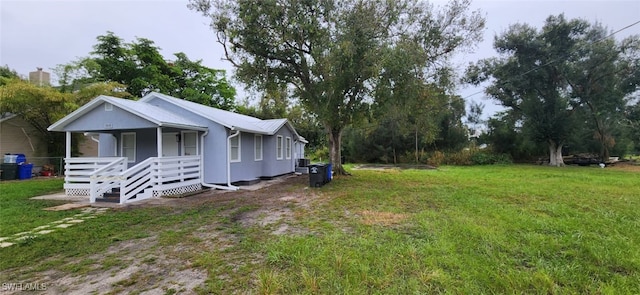 view of yard featuring covered porch