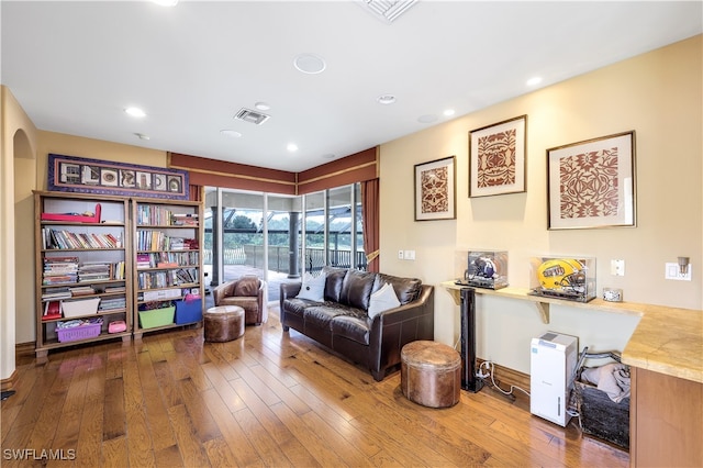 sitting room featuring wood-type flooring