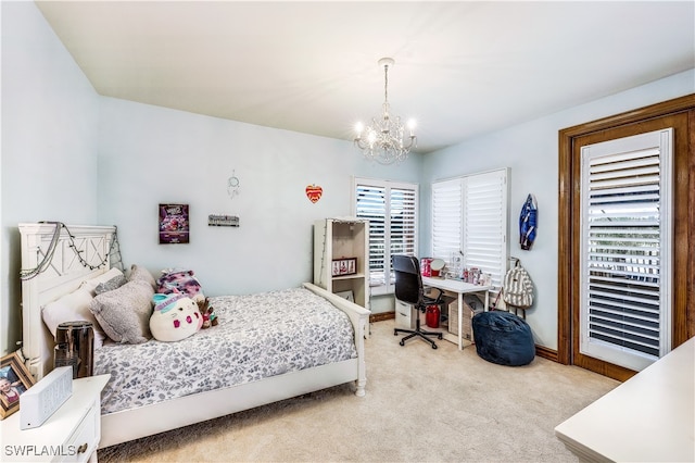 carpeted bedroom with multiple windows and a notable chandelier