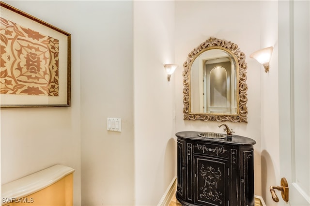 bathroom featuring vanity and toilet