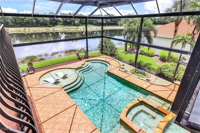 view of swimming pool with an in ground hot tub, a water view, a patio area, and a lanai