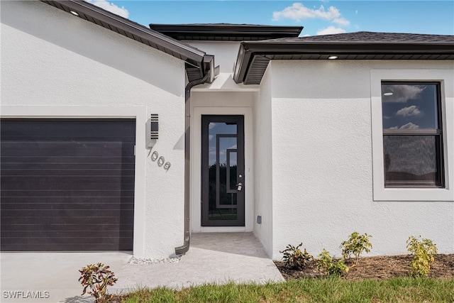 property entrance with a garage