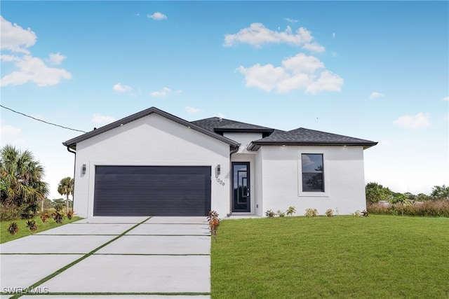 view of front facade featuring a front yard and a garage