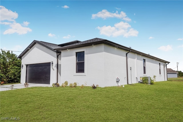 view of home's exterior featuring a lawn and a garage