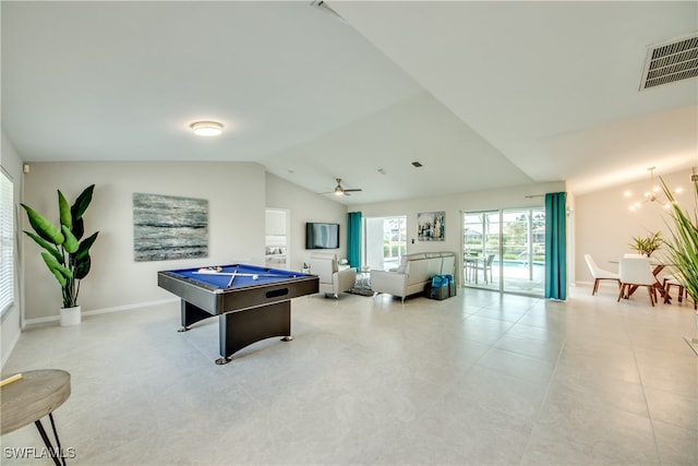 game room featuring ceiling fan with notable chandelier, light tile patterned flooring, vaulted ceiling, and pool table