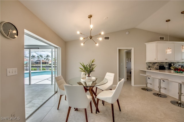 dining area with light tile patterned floors, lofted ceiling, and a notable chandelier