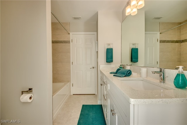 bathroom featuring vanity and tiled shower / bath combo